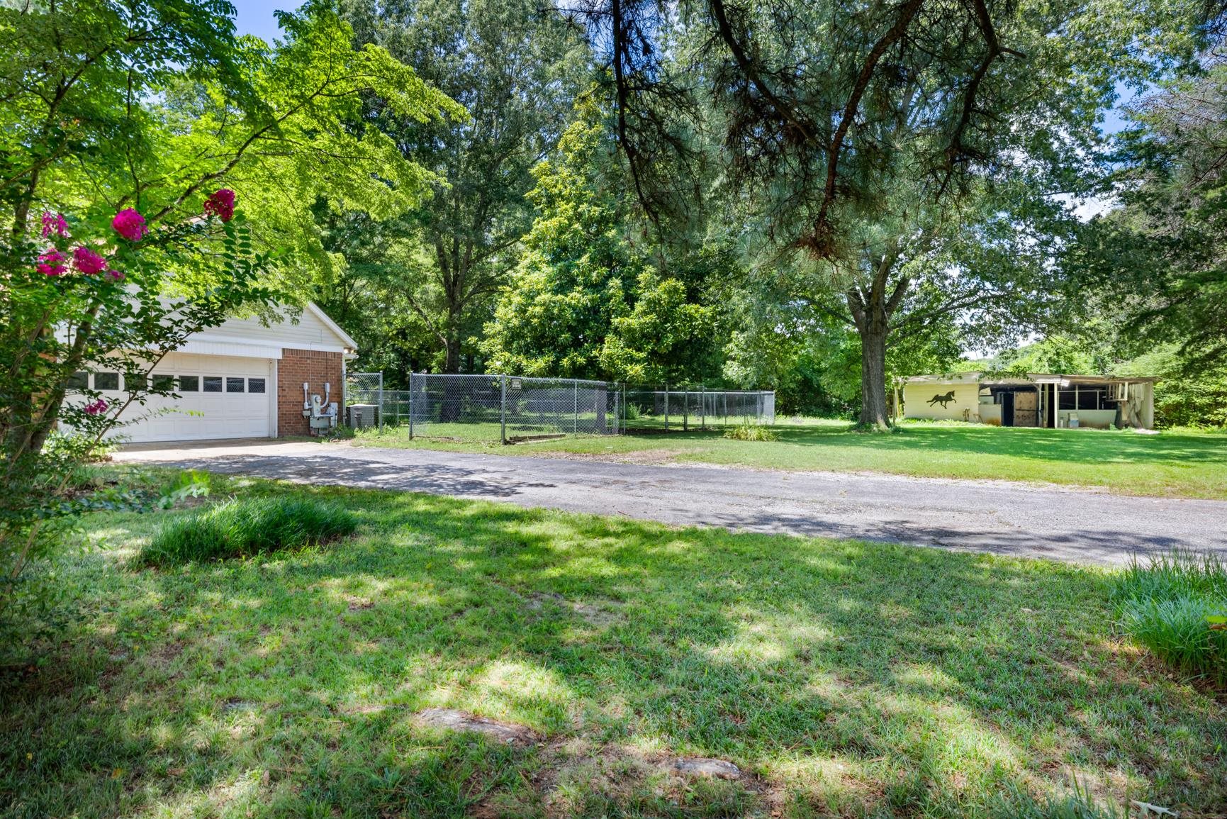 5015 Eagles Nest Lane Bartlett, TN 38002 - Photo 39 of 39 View of yard with driveway and a detached garage