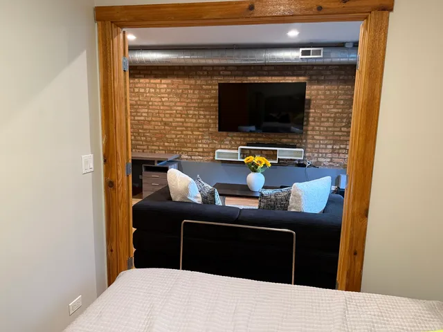 a living room with a couch and a flat screen tv