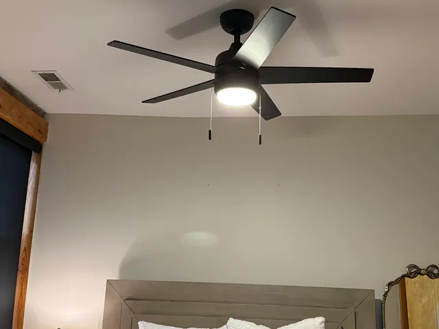 a bathroom with a shower and a mirror