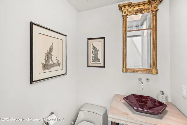 a bathroom with a toilet and a sink