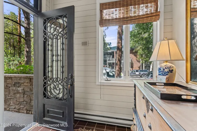 a kitchen with a stove a sink and a window