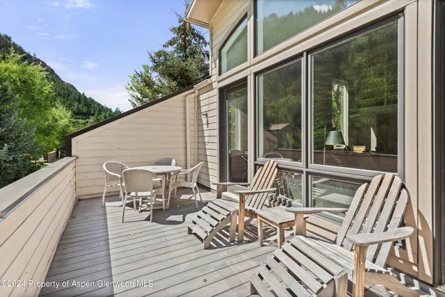 a view of balcony with couch and wooden floor