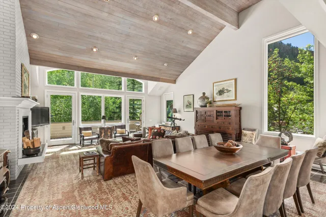 a view of a dining room with furniture window and outside view