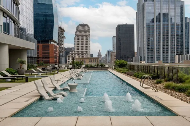 a view of swimming pool with outdoor seating