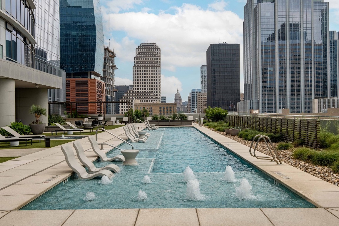 200 Congress Avenue, Unit 14A Austin, TX 78701 - Photo 1 of 40 a view of swimming pool with outdoor seating
