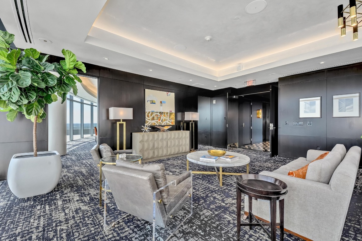 200 Congress Avenue, Unit 14A Austin, TX 78701 - Photo 33 of 40 a living room with furniture and a potted plant