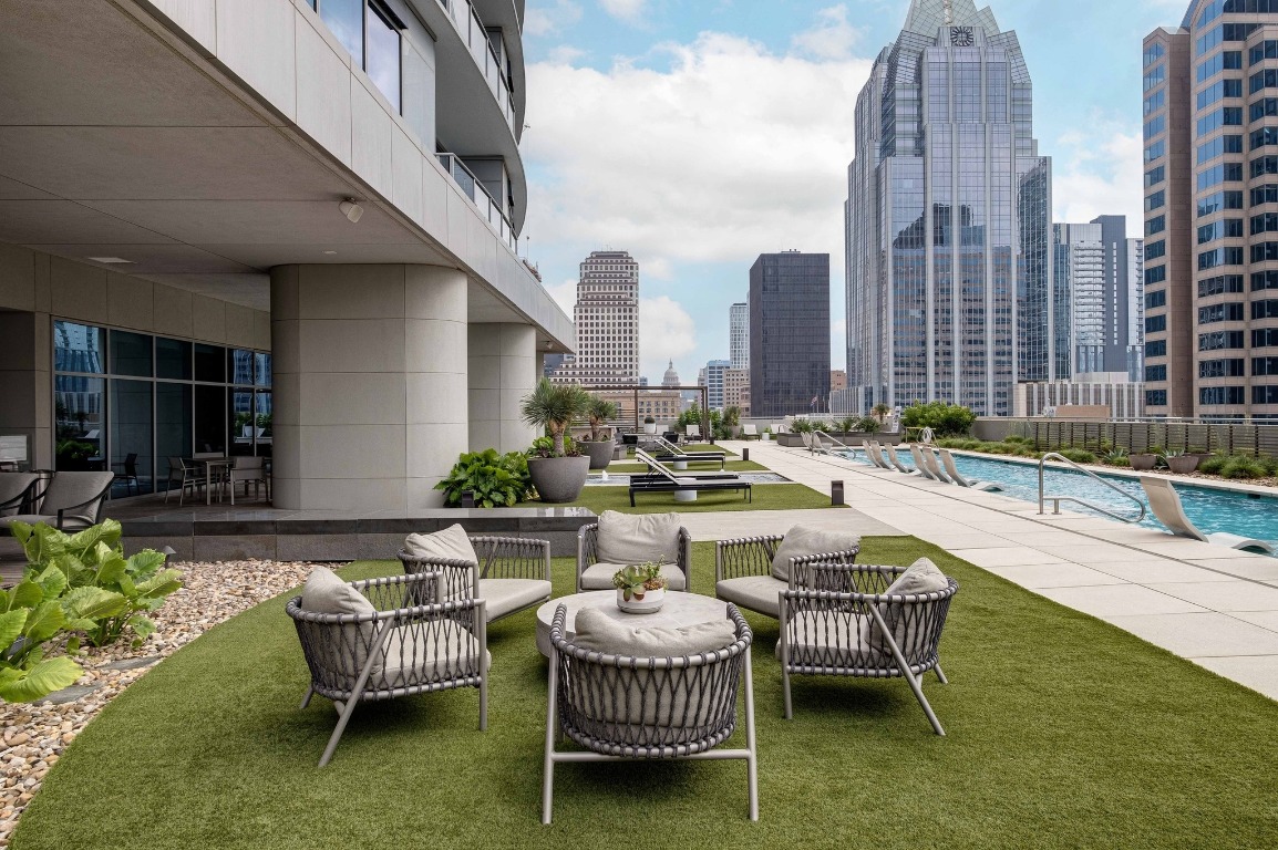 200 Congress Avenue, Unit 14A Austin, TX 78701 - Photo 34 of 40 a swimming pool with outdoor seating and outdoor seating