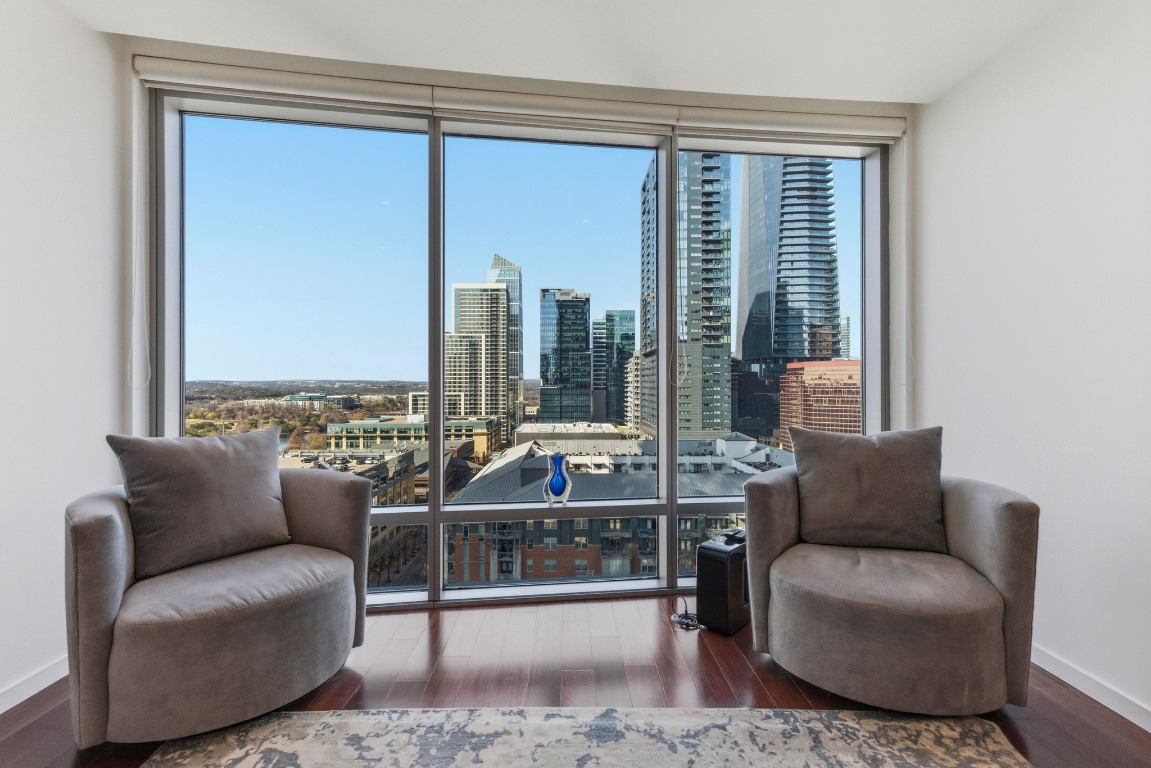 200 Congress Avenue, Unit 14A Austin, TX 78701 - Photo 5 of 40 a living room with furniture and a large window