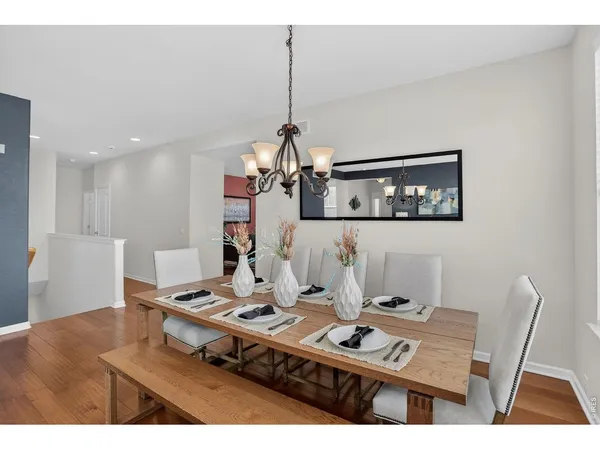 a living room with a table and chairs