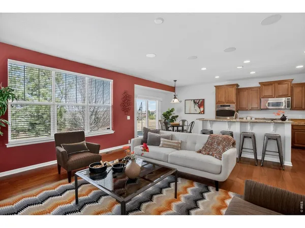 a living room with furniture potted plant and a fireplace