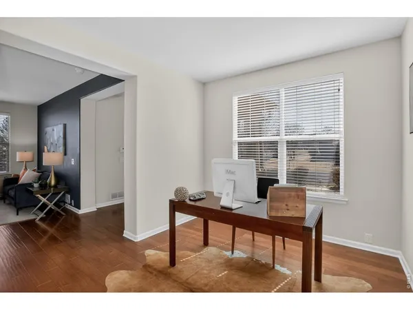 a workspace with furniture and a window