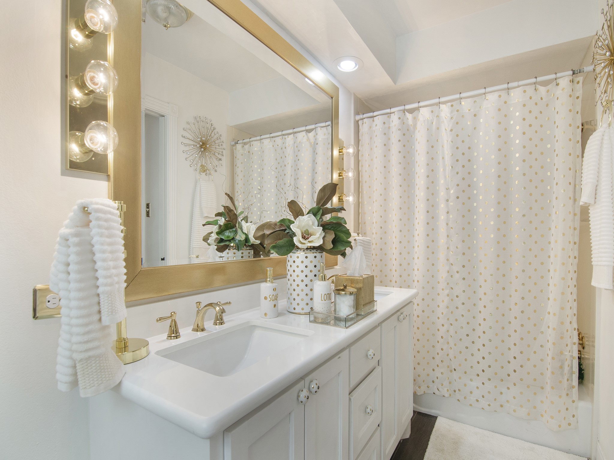 532 Raleigh Drive Conroe, TX 77302 - Photo 12 of 40 Bright primary bathroom features double sink vanity and elegant gold accents.