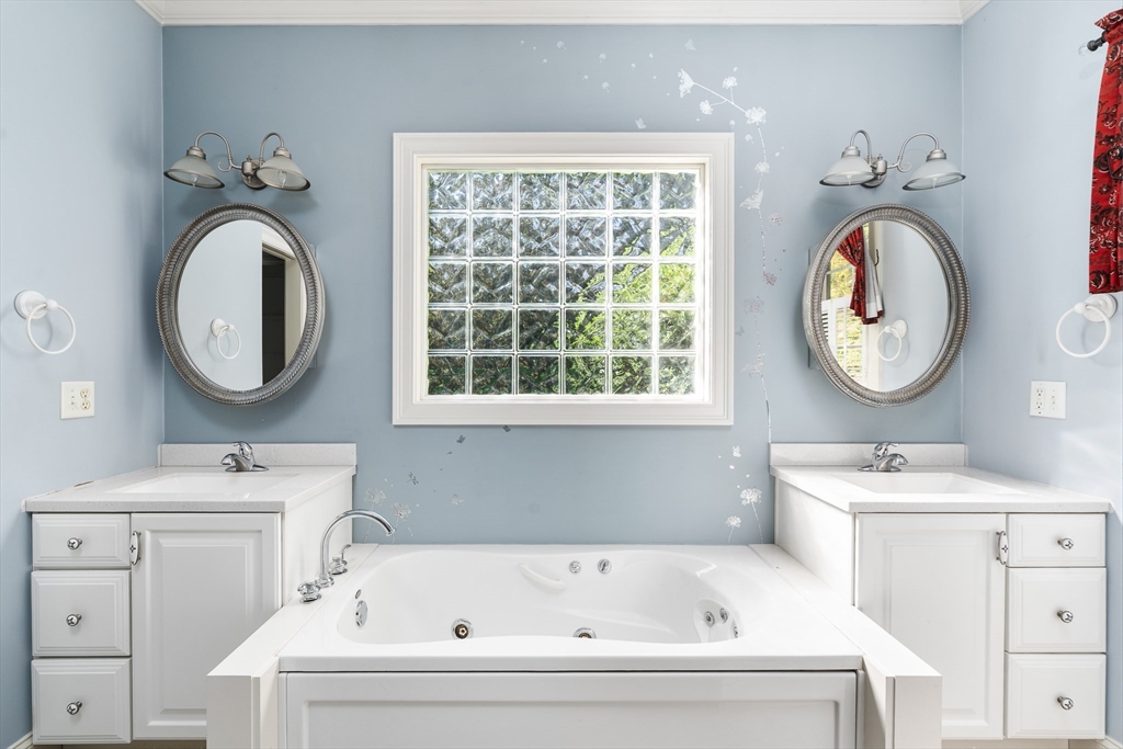 10 Golden Circle Southampton, MA 01073 - Photo 15 of 33 a bathroom with a sink a toilet and a mirror