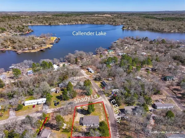 a view of a lake with a building in the background