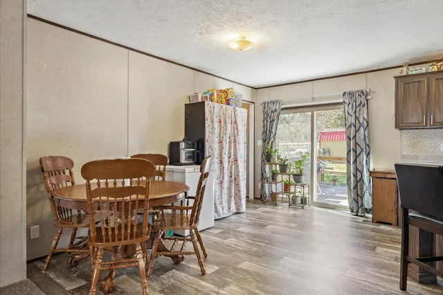 a view of a livingroom with furniture window and wooden floor