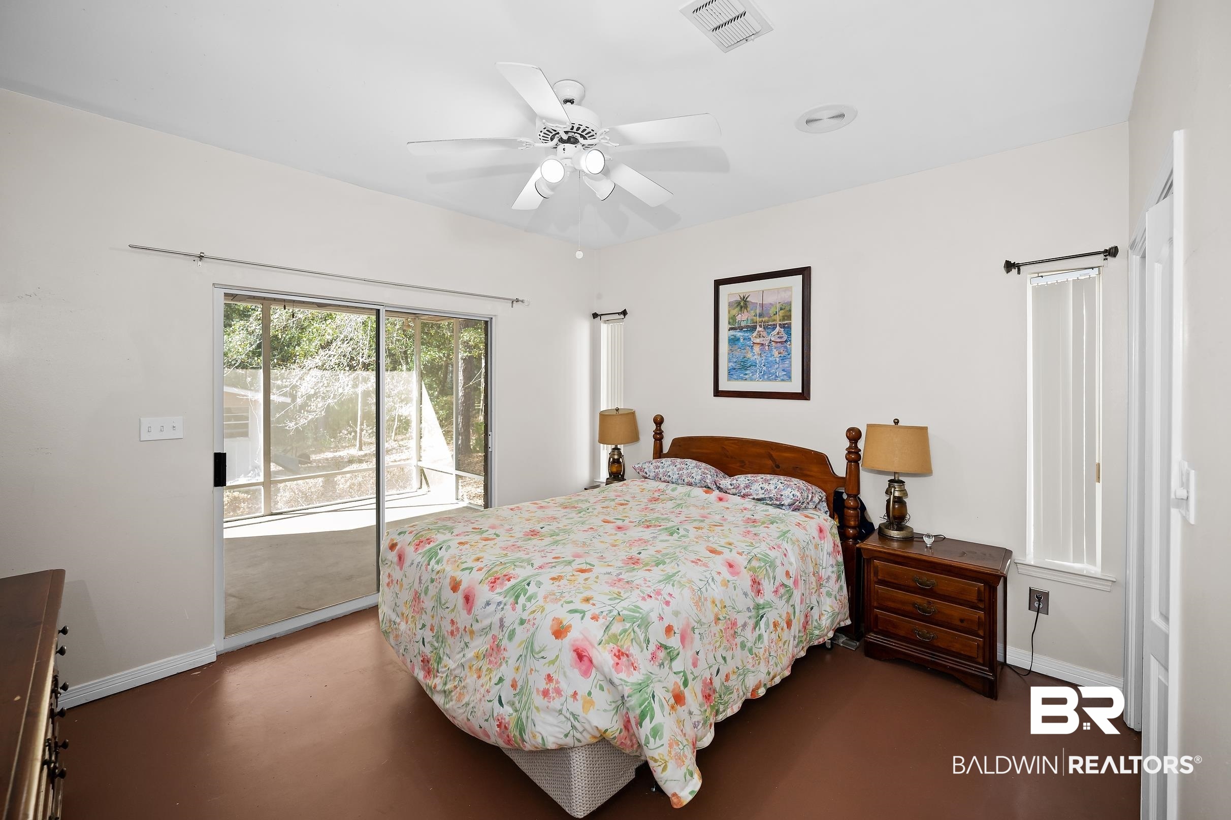 2674 Pine Ridge Drive Lillian, AL 36549 - Photo 16 of 42 Bedroom with access to outside, concrete floors, and ceiling fan