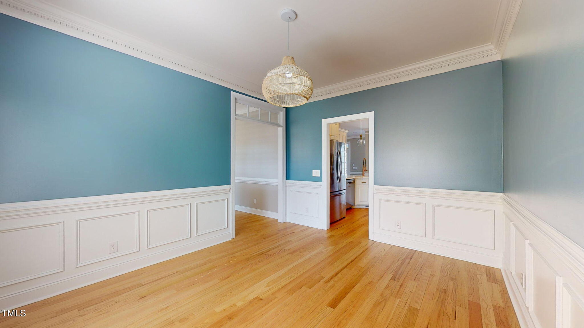 5813 Turner Store Lane Raleigh, NC 27603 - Photo 11 of 35 a large space with chandelier fan and wooden floor