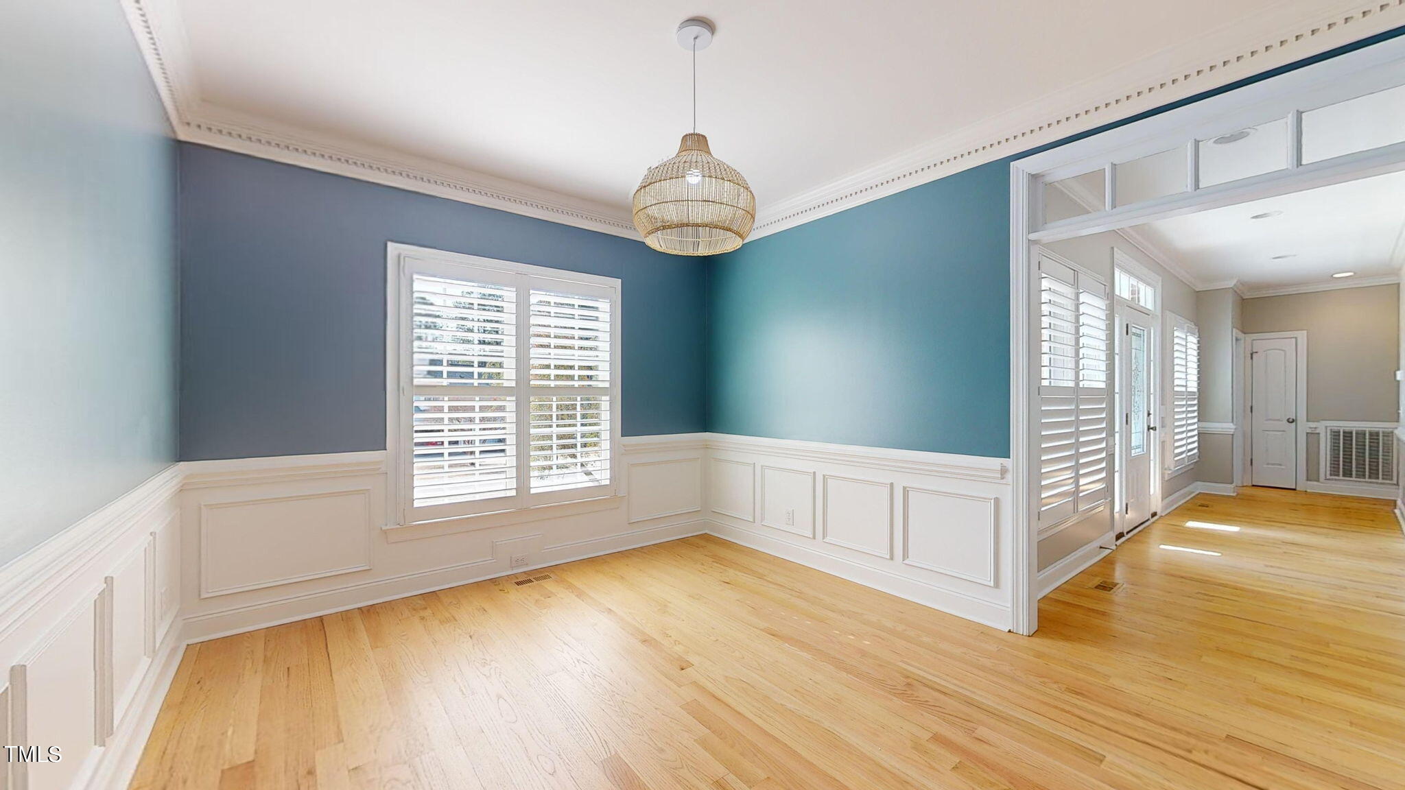 5813 Turner Store Lane Raleigh, NC 27603 - Photo 12 of 35 a view of an empty room with wooden floor and a window