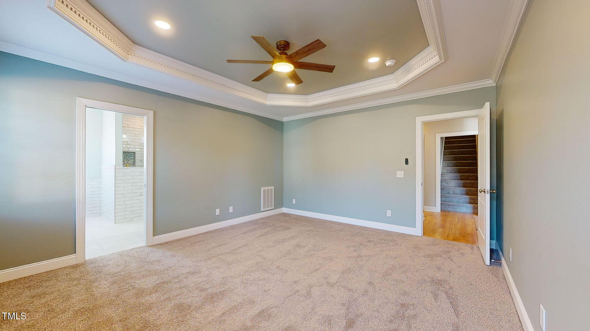 5813 Turner Store Lane Raleigh, NC 27603 - Photo 14 of 35 a view of an empty room with a ceiling fan
