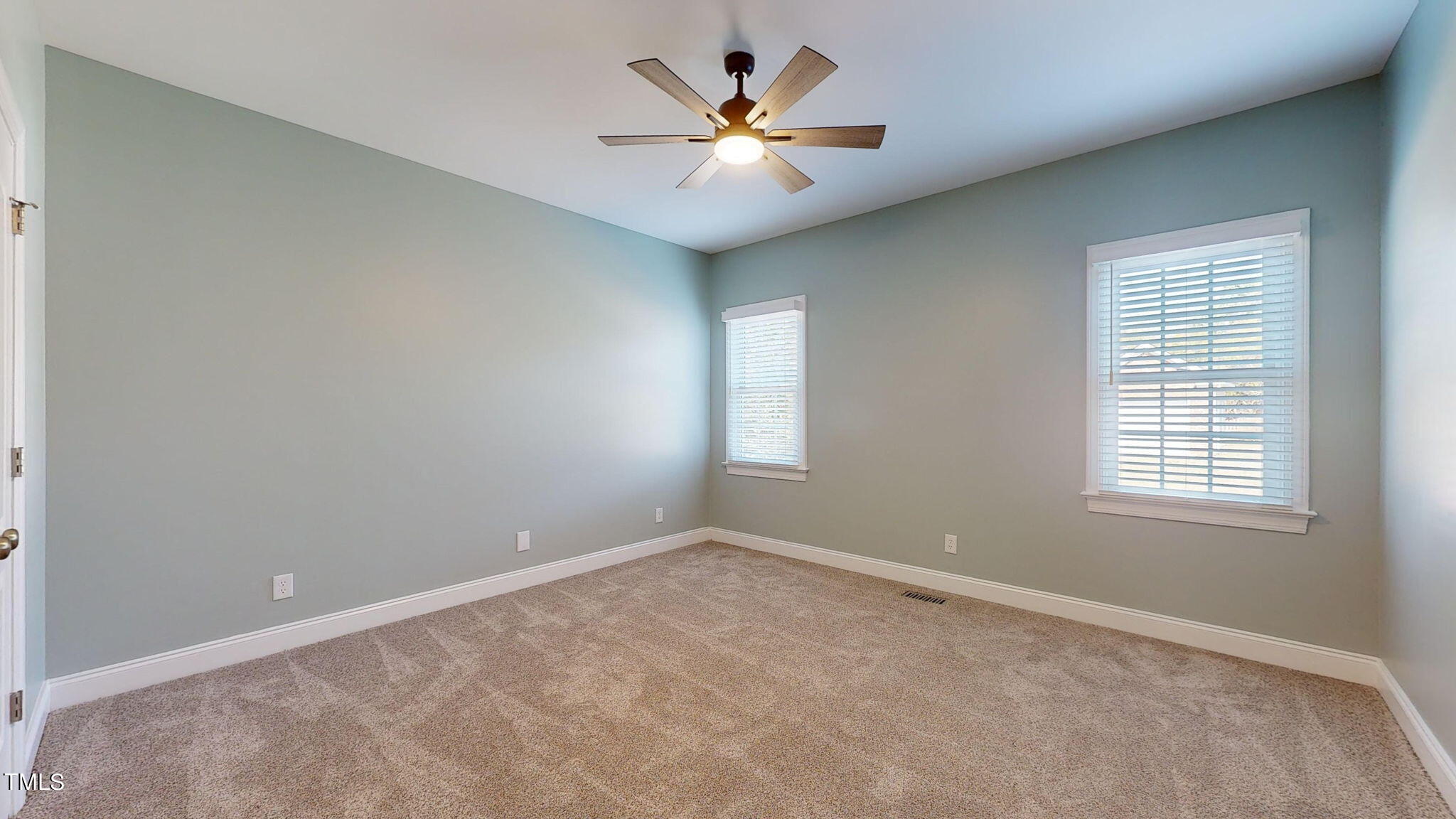 5813 Turner Store Lane Raleigh, NC 27603 - Photo 19 of 35 an empty room with fan and windows