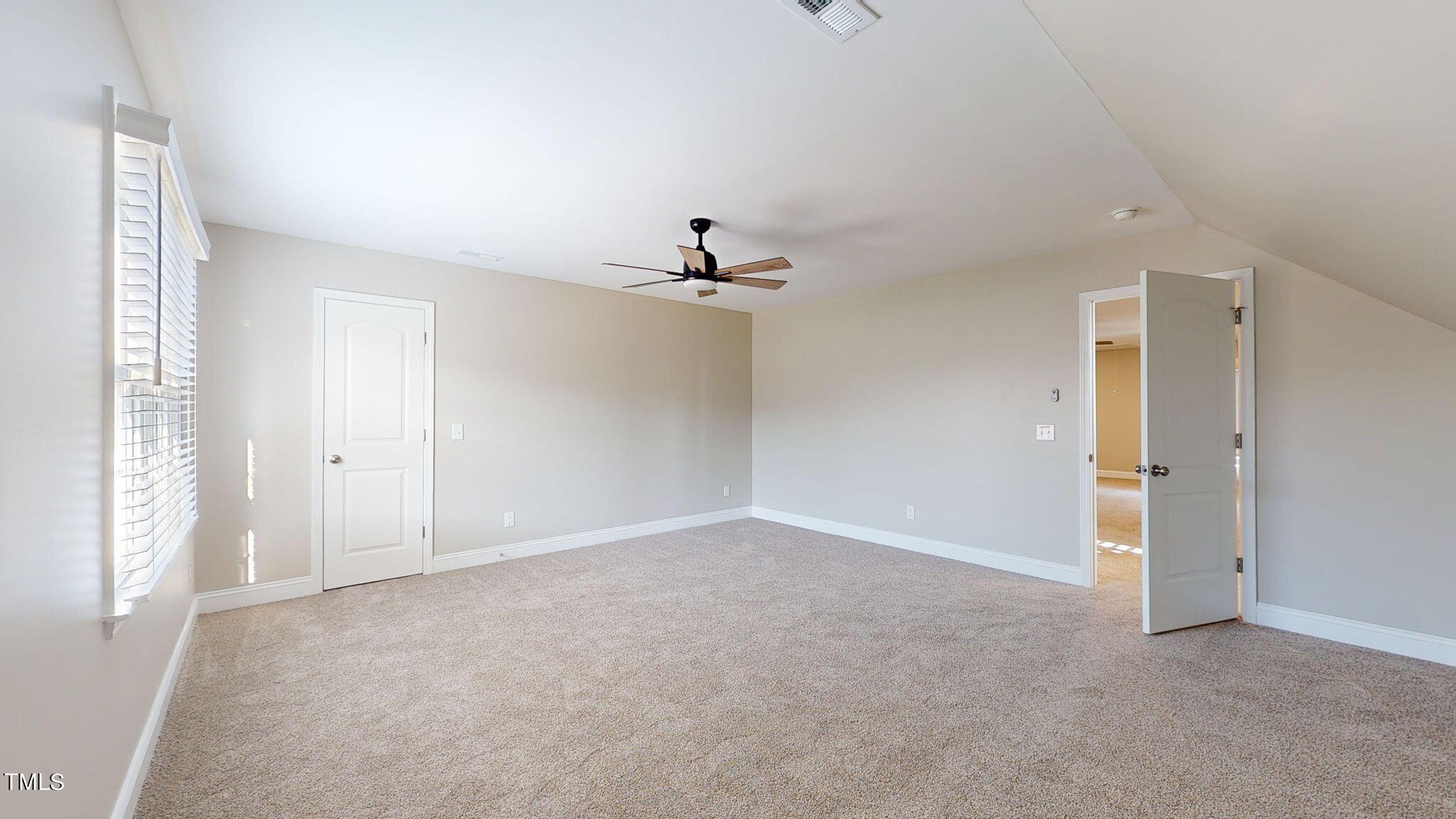 5813 Turner Store Lane Raleigh, NC 27603 - Photo 22 of 35 a view of an empty room with a window
