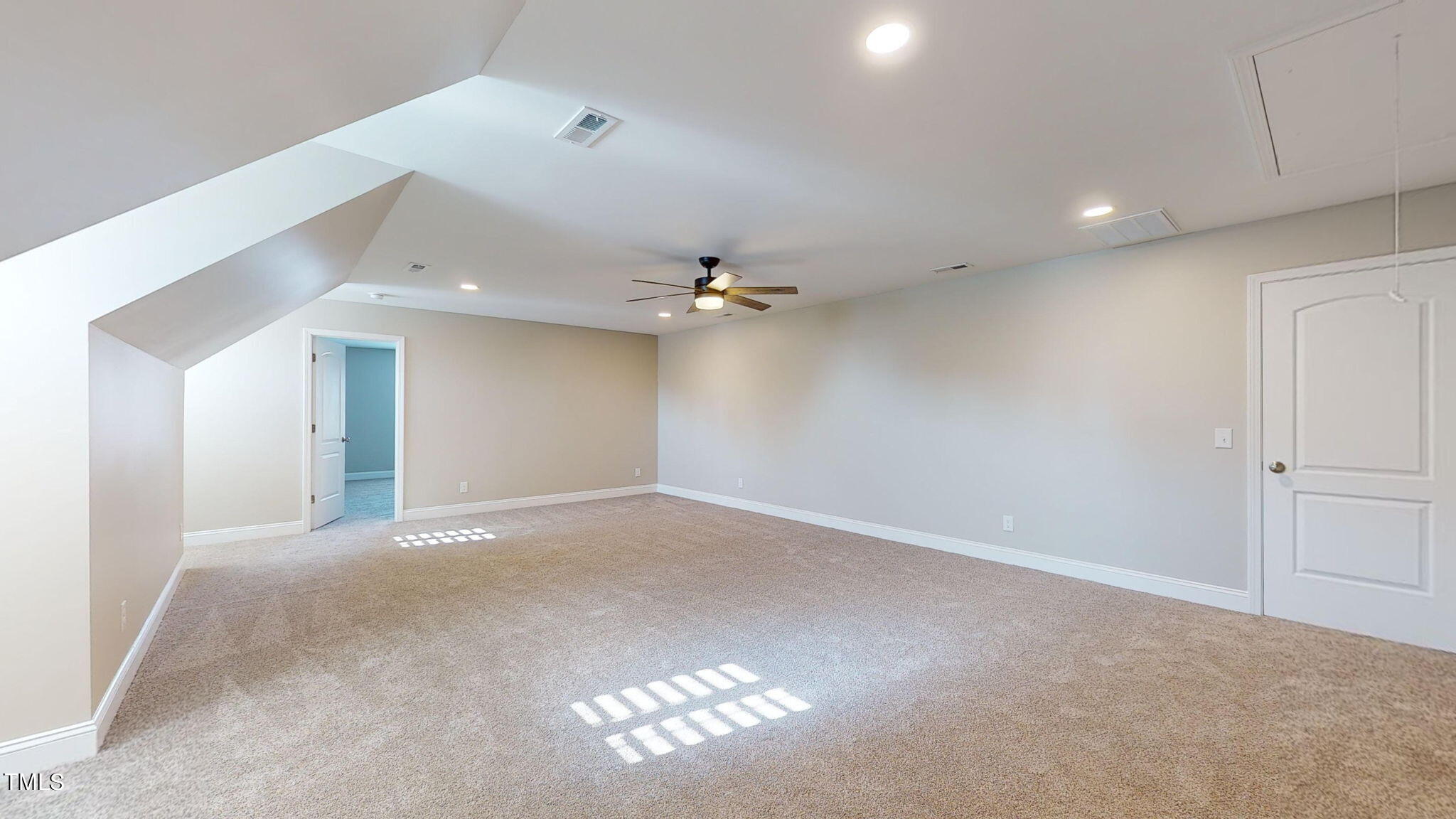 5813 Turner Store Lane Raleigh, NC 27603 - Photo 23 of 35 an empty room with windows and fan