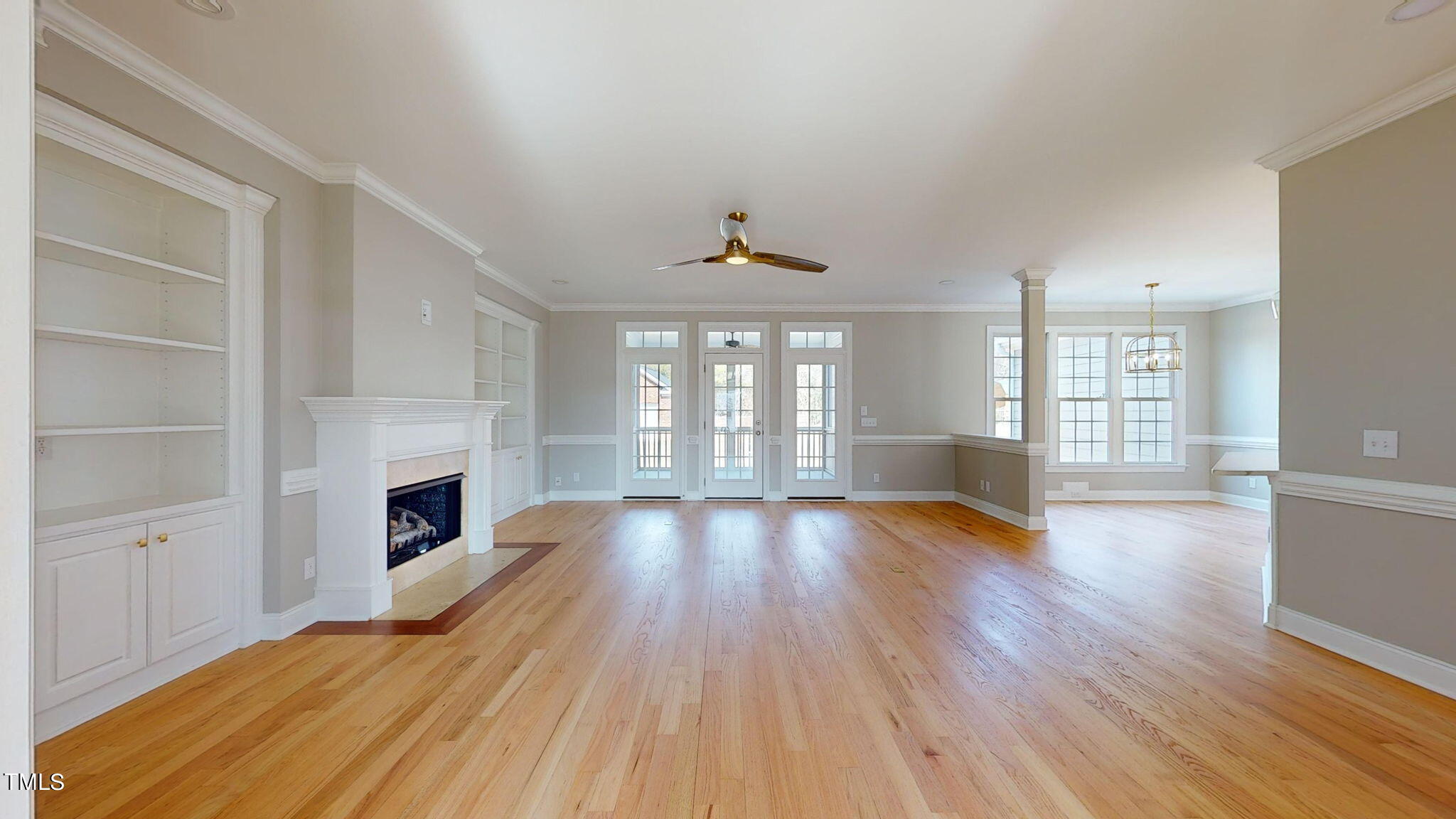 5813 Turner Store Lane Raleigh, NC 27603 - Photo 3 of 35 a view of an empty room with wooden floor and a window