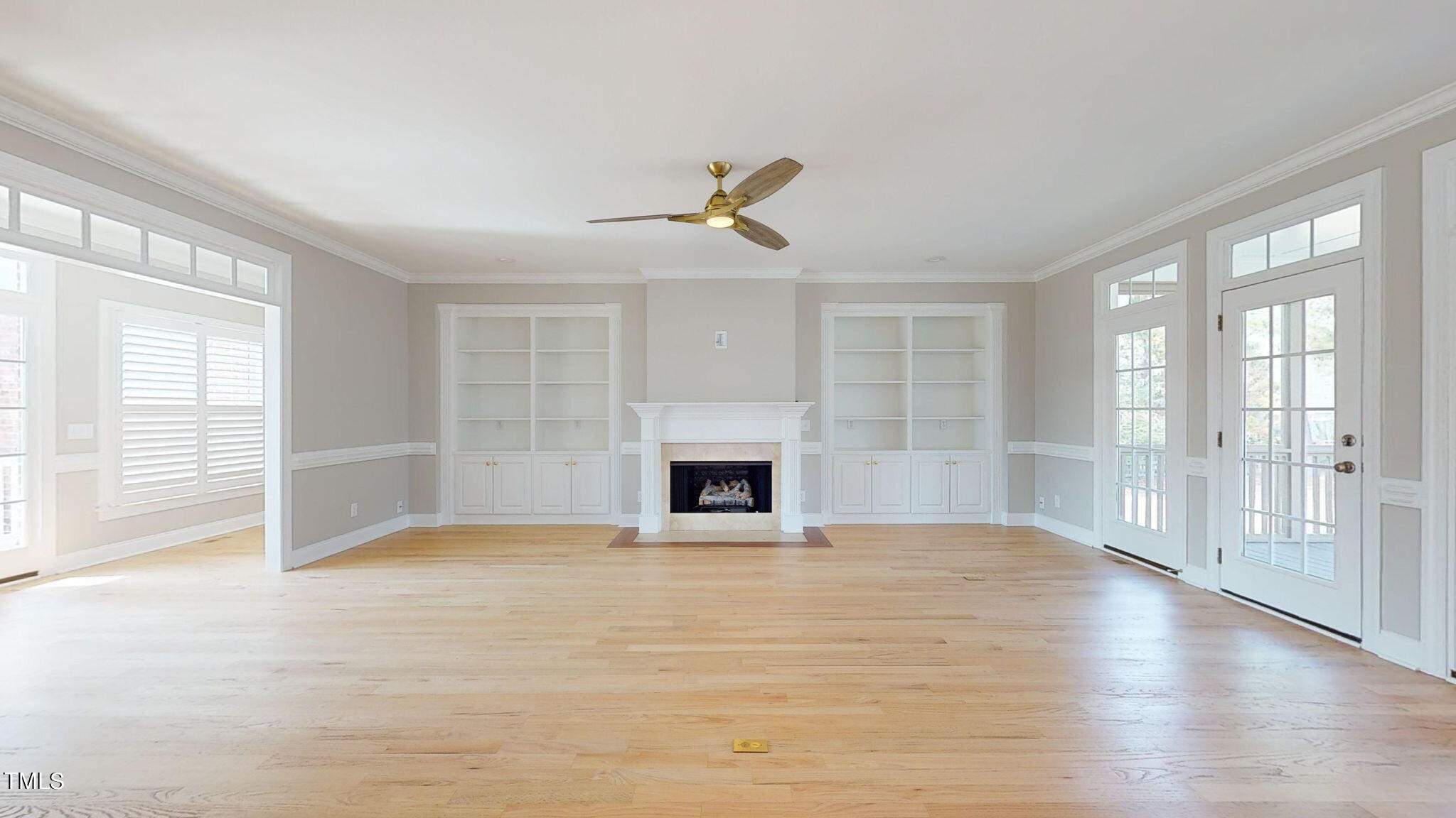 5813 Turner Store Lane Raleigh, NC 27603 - Photo 4 of 35 wooden floor fireplace and windows in an empty room