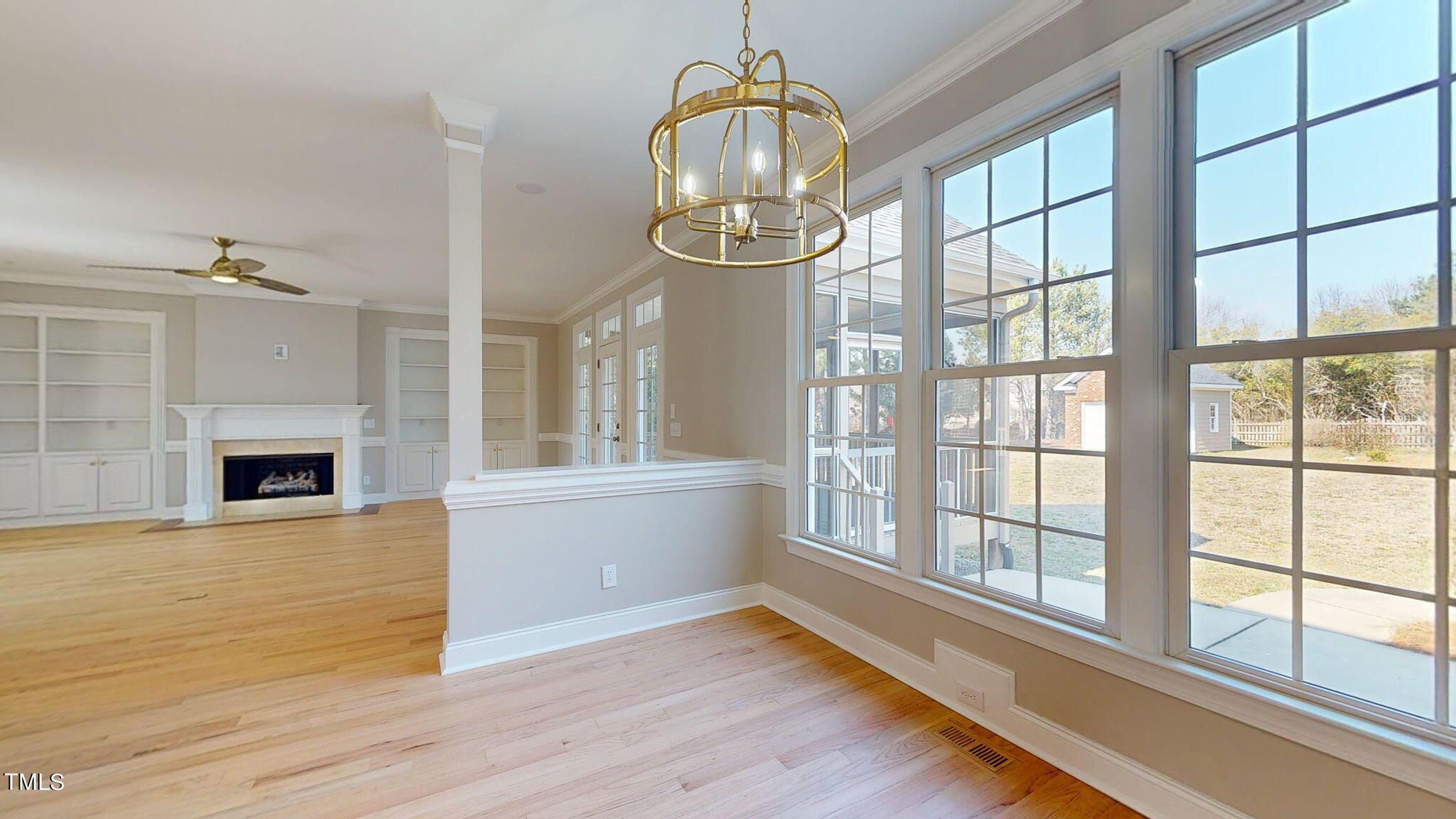 5813 Turner Store Lane Raleigh, NC 27603 - Photo 5 of 35 a view of an empty room with wooden floor and a window