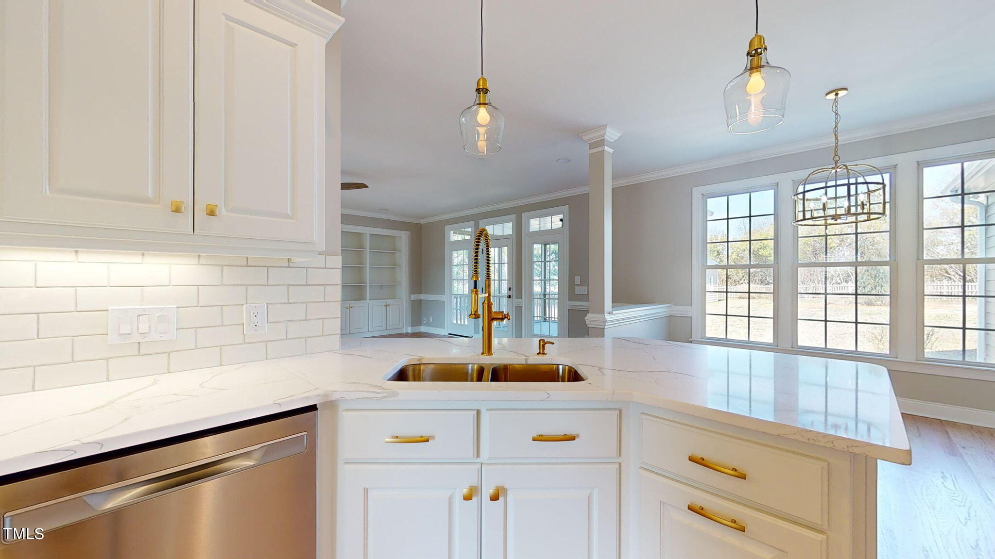 5813 Turner Store Lane Raleigh, NC 27603 - Photo 9 of 35 a kitchen with a sink and cabinets