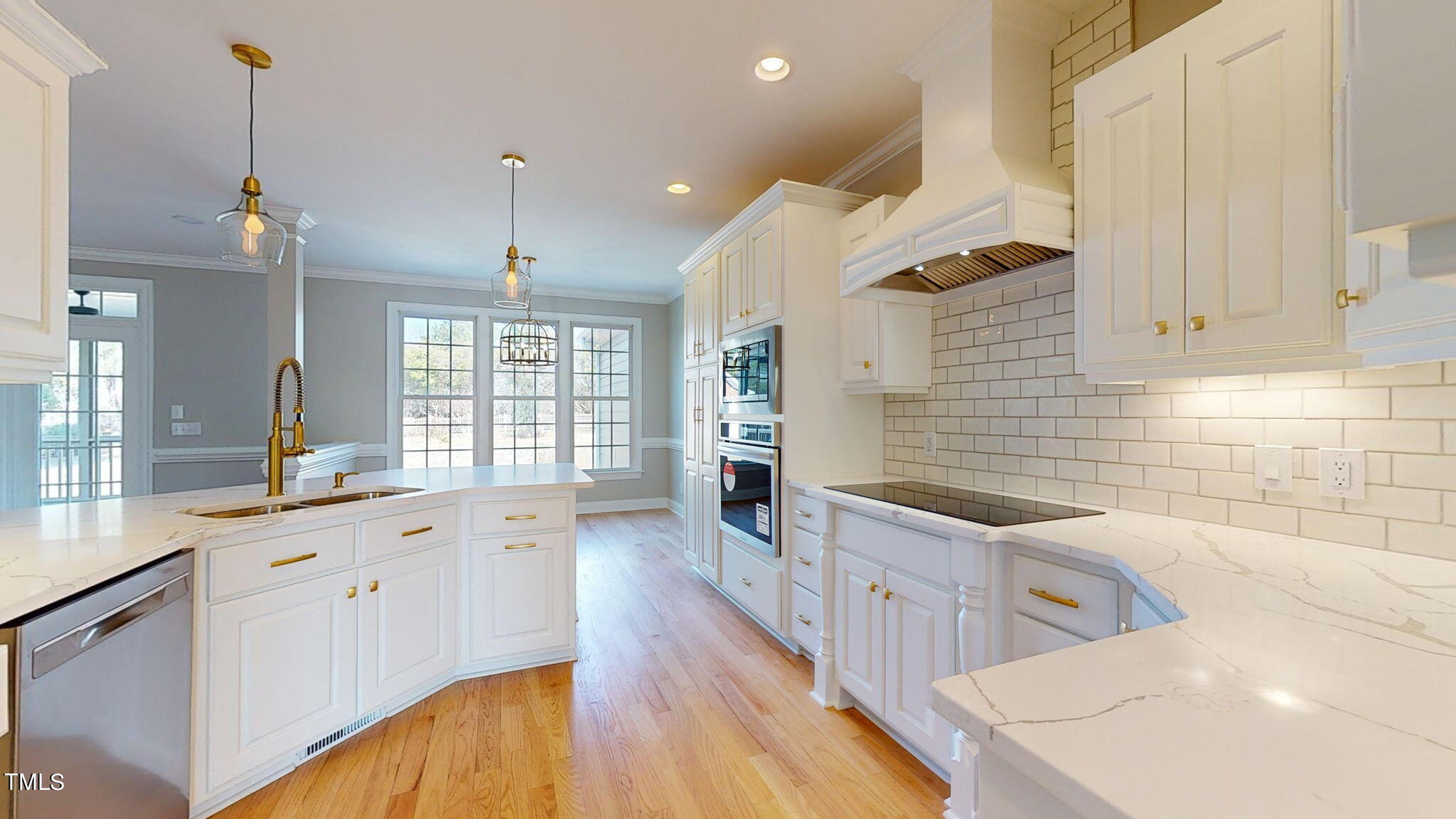 5813 Turner Store Lane Raleigh, NC 27603 - Photo 10 of 35 a kitchen with sink cabinets and window