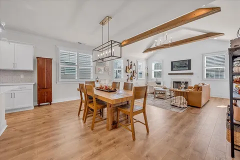 a dining room with furniture and window