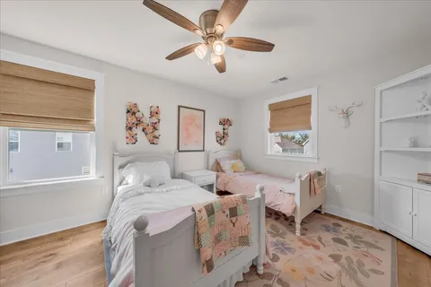 a bedroom with furniture and a window