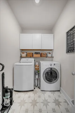 a front view of a house with a garden and plants