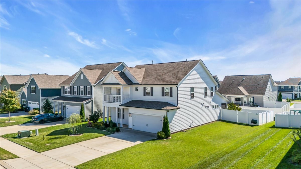 5116 Bridgemore Boulevard Murfreesboro, TN 37129 - Photo 28 of 38 a front view of a house with a garden and plants