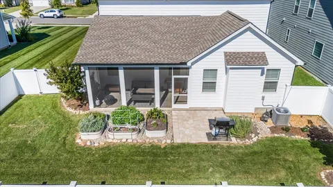 a view of house with backyard outdoor seating and green space