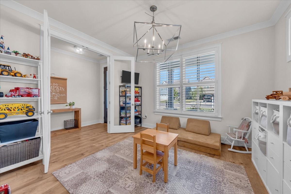 5116 Bridgemore Boulevard Murfreesboro, TN 37129 - Photo 8 of 38 a living room with furniture and a chandelier
