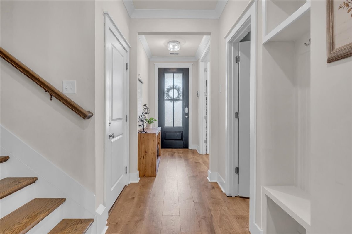 5116 Bridgemore Boulevard Murfreesboro, TN 37129 - Photo 9 of 38 a view of a hallway with wooden floor and staircase