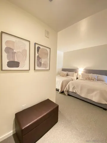 a bedroom with bed and window