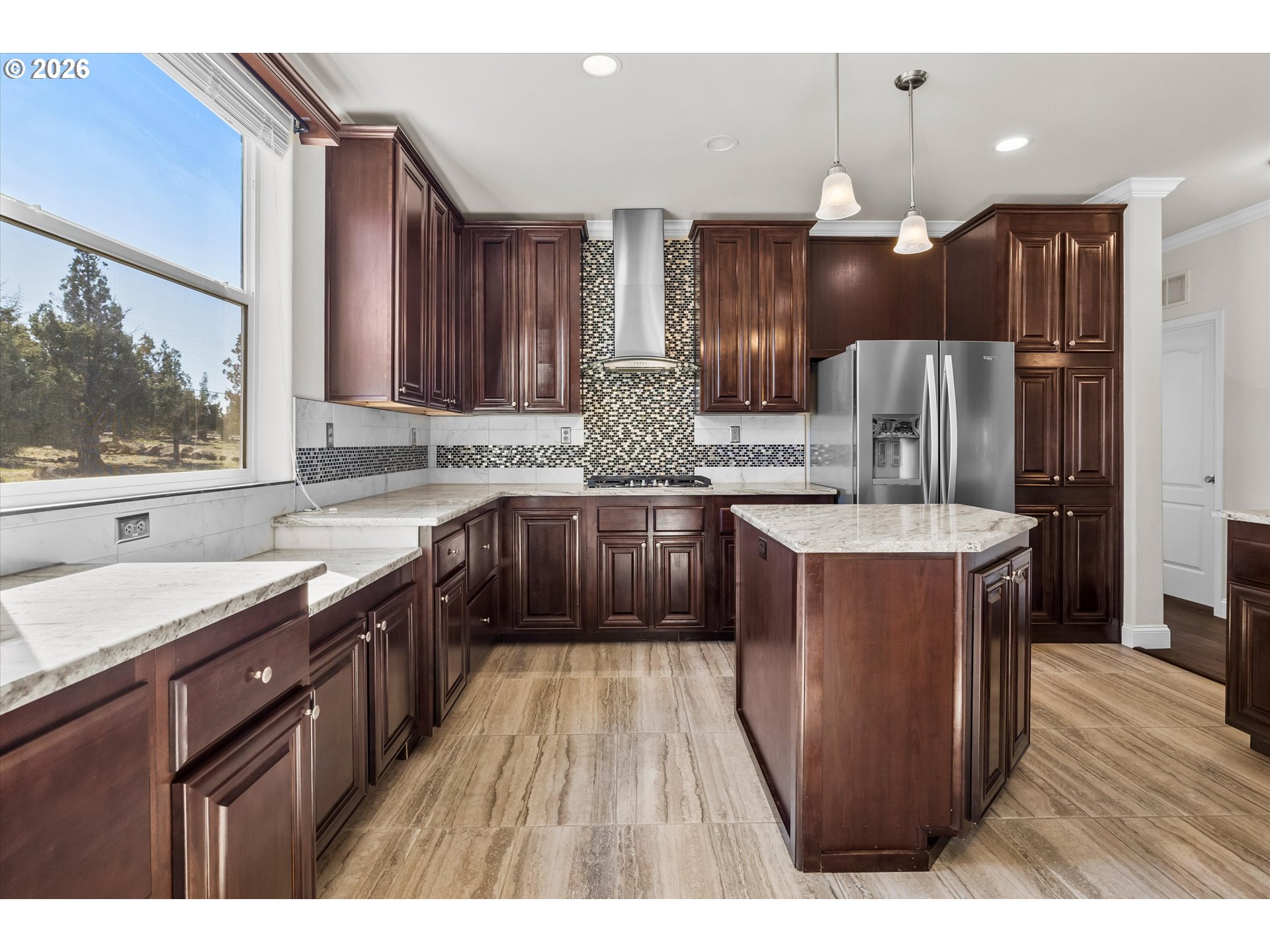 5172 Southeast Oswego Road Prineville, OR 97754 - Photo 8 of 48 a kitchen with kitchen island granite countertop a sink stove and refrigerator