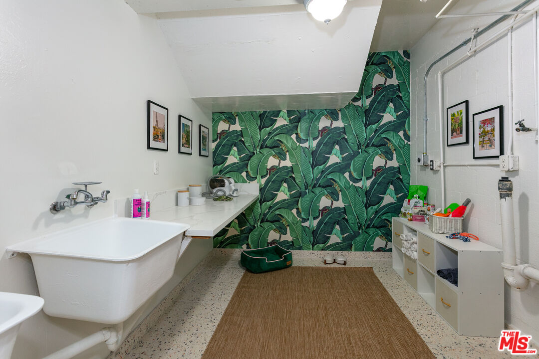 301 South Rexford Drive, Unit 2 Beverly Hills, CA 90212 - Photo 20 of 23 a white bath tub sitting in a bathroom