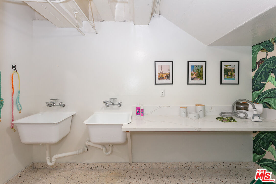 301 South Rexford Drive, Unit 2 Beverly Hills, CA 90212 - Photo 21 of 23 a bathroom with a sink and a mirror