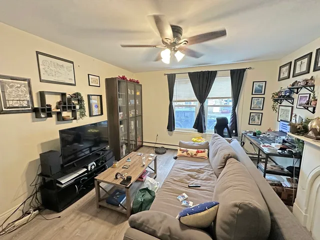 a bedroom with furniture and a wooden floor
