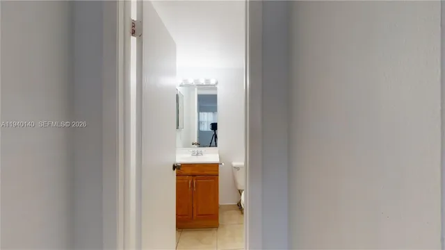 a en suite bathroom with a toilet sink and mirror