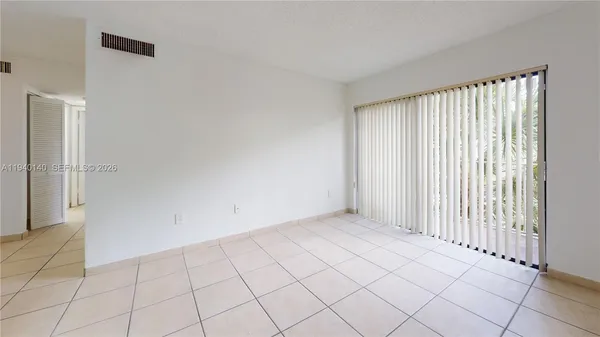 a view of an empty room and window