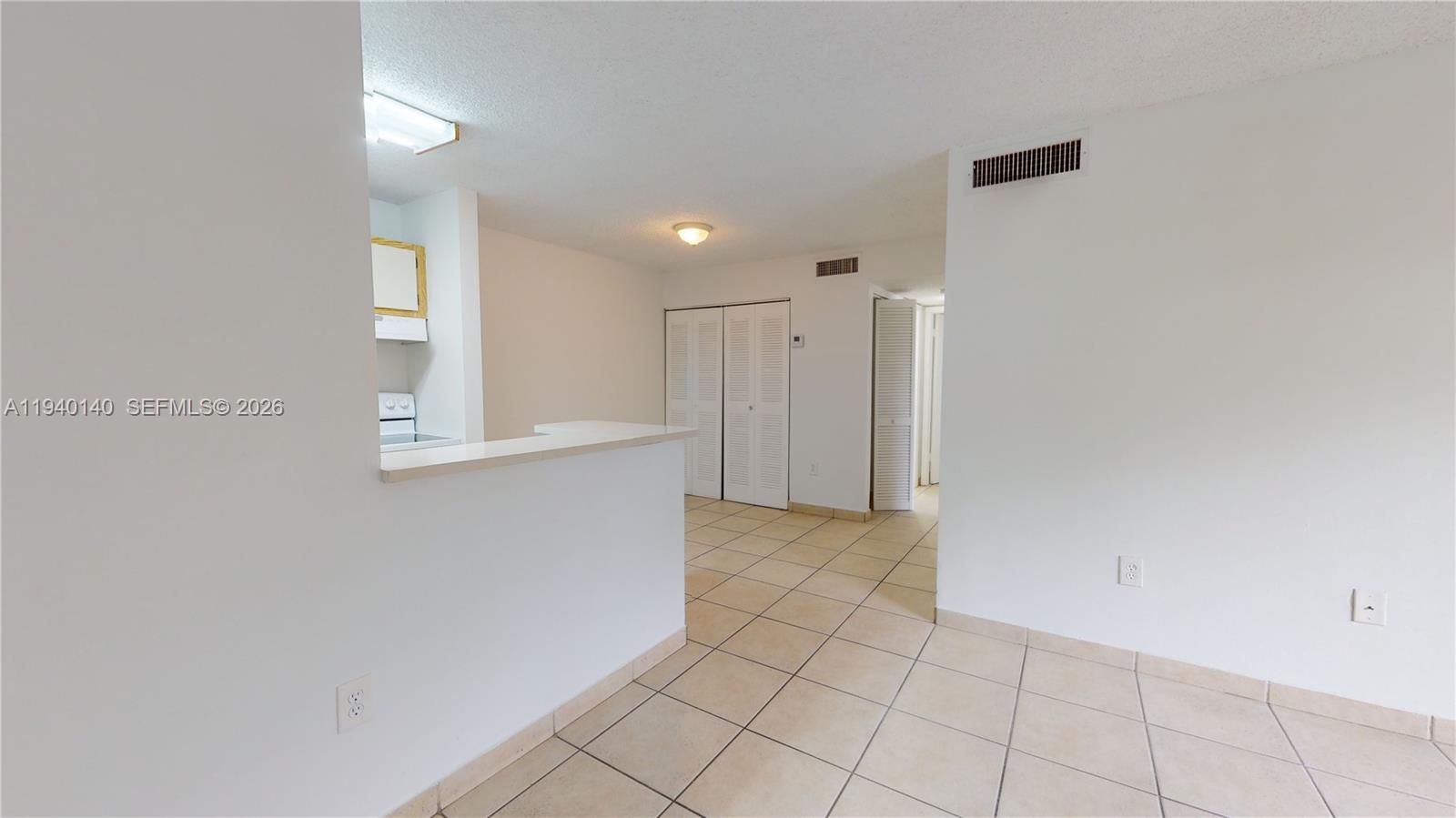 15600 Southwest 80th Street, Unit L202 Miami, FL 33193 - Photo 2 of 18 a view of an empty room
