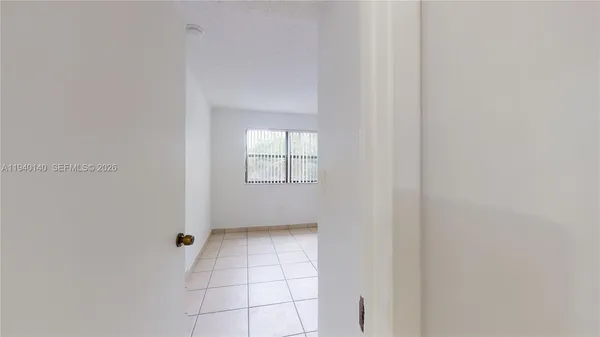 a view of an empty room with a window