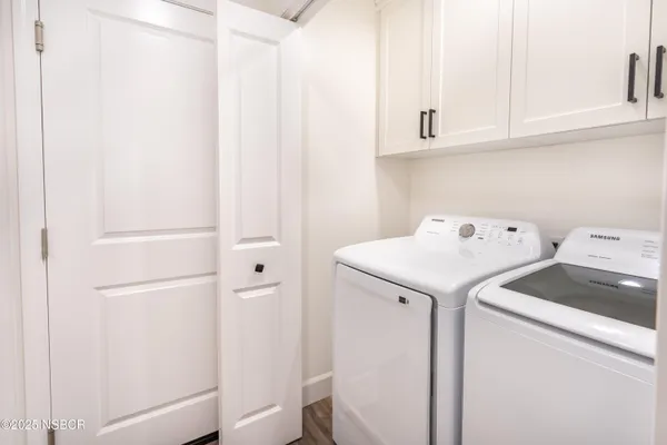 a bathroom with a granite countertop sink a toilet and a mirror