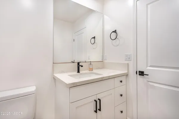 a view of walk in closet with clothes