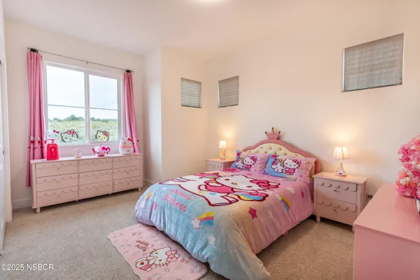 a bathroom with a sink mirror vanity and toilet